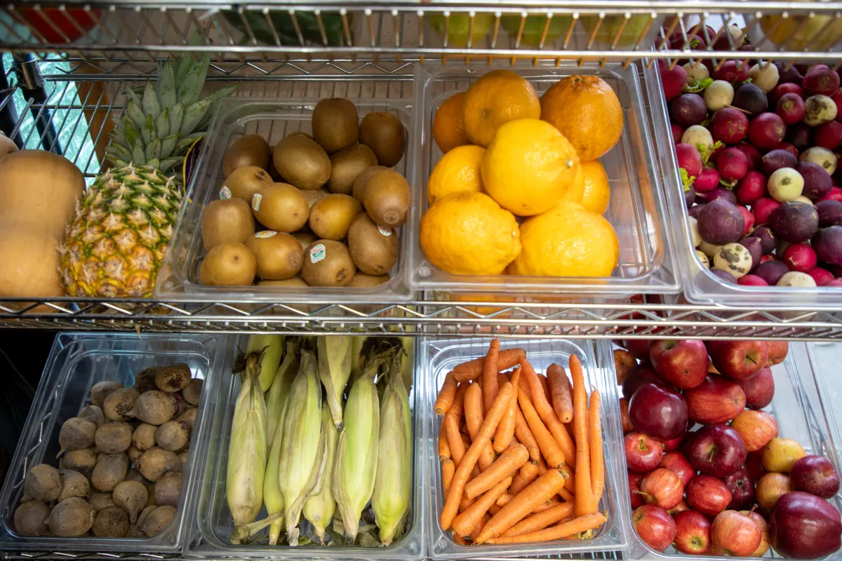 Neighbors choosing groceries in the Choice Food Pantry storefront